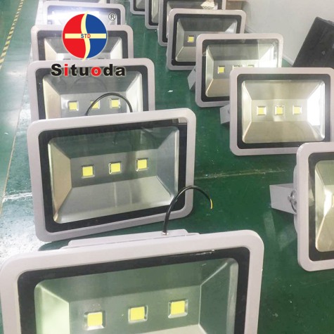 Floodlight processing and assembly